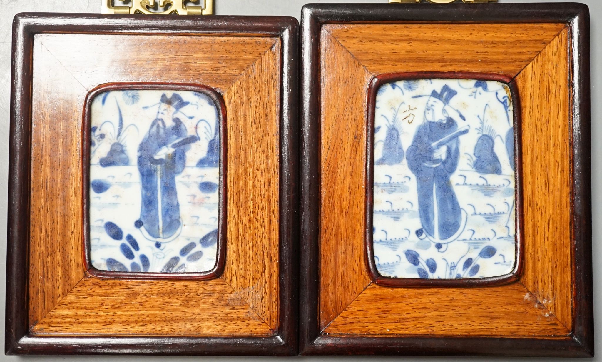 A pair of Chinese framed blue and white tiles, total size 16 cm X 13.5 cm